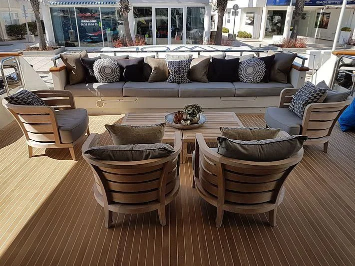 a living room with a couch and a table aboard AWAY Yacht for Charter
