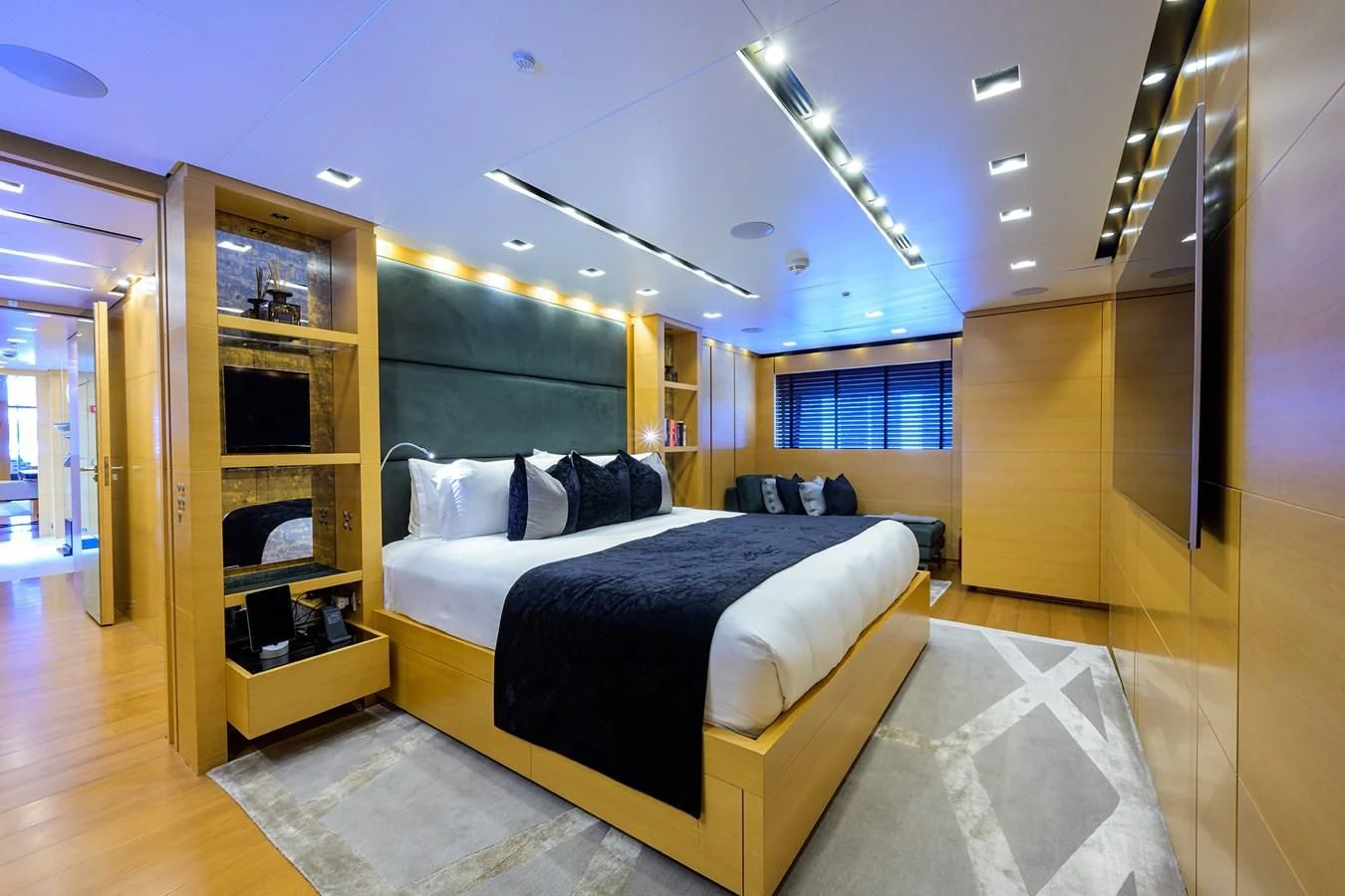 a bedroom with a large bed aboard AWAY Yacht for Charter