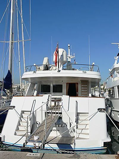 a boat docked at a pier aboard BACHATA QUEEN Yacht for Sale