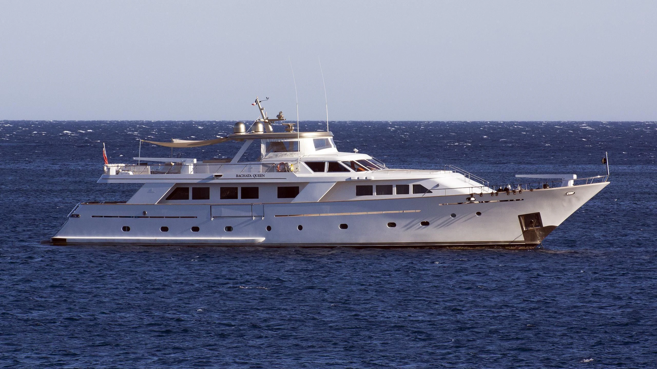 a large white yacht in the water aboard BACHATA QUEEN Yacht for Sale