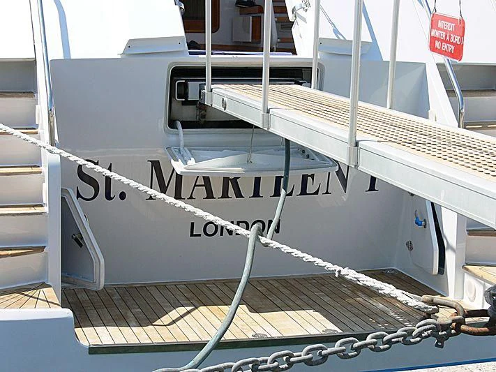 a white boat with black text aboard BACHATA QUEEN Yacht for Sale