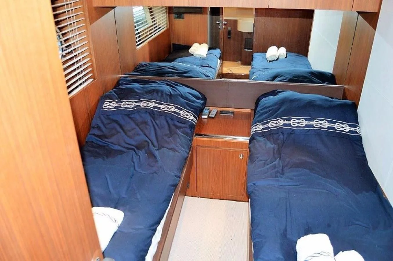 a room with bunk beds aboard BLACK SWAN Yacht for Sale