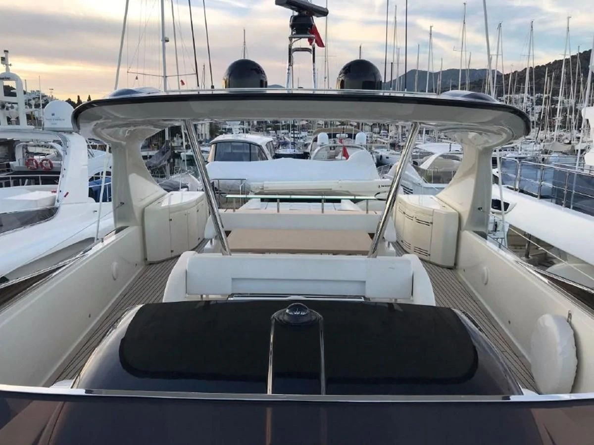 a boat with a steering wheel aboard BLACK SWAN Yacht for Sale