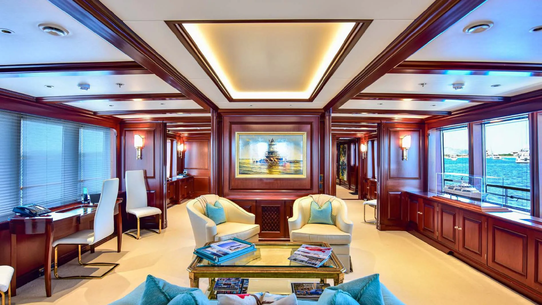 a living room with a large window aboard HALCYON Yacht for Sale