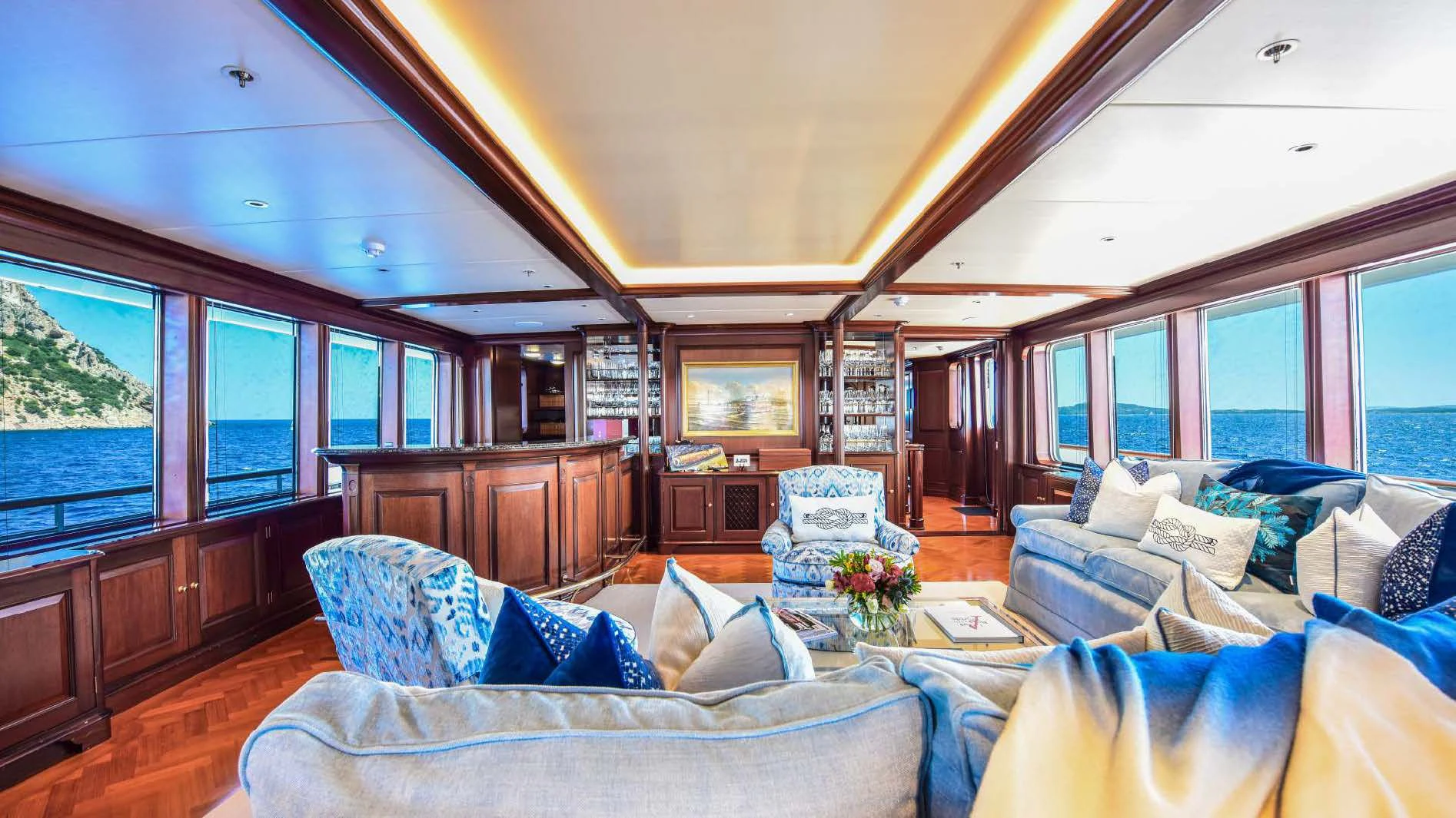 a living room with a large window aboard HALCYON Yacht for Sale