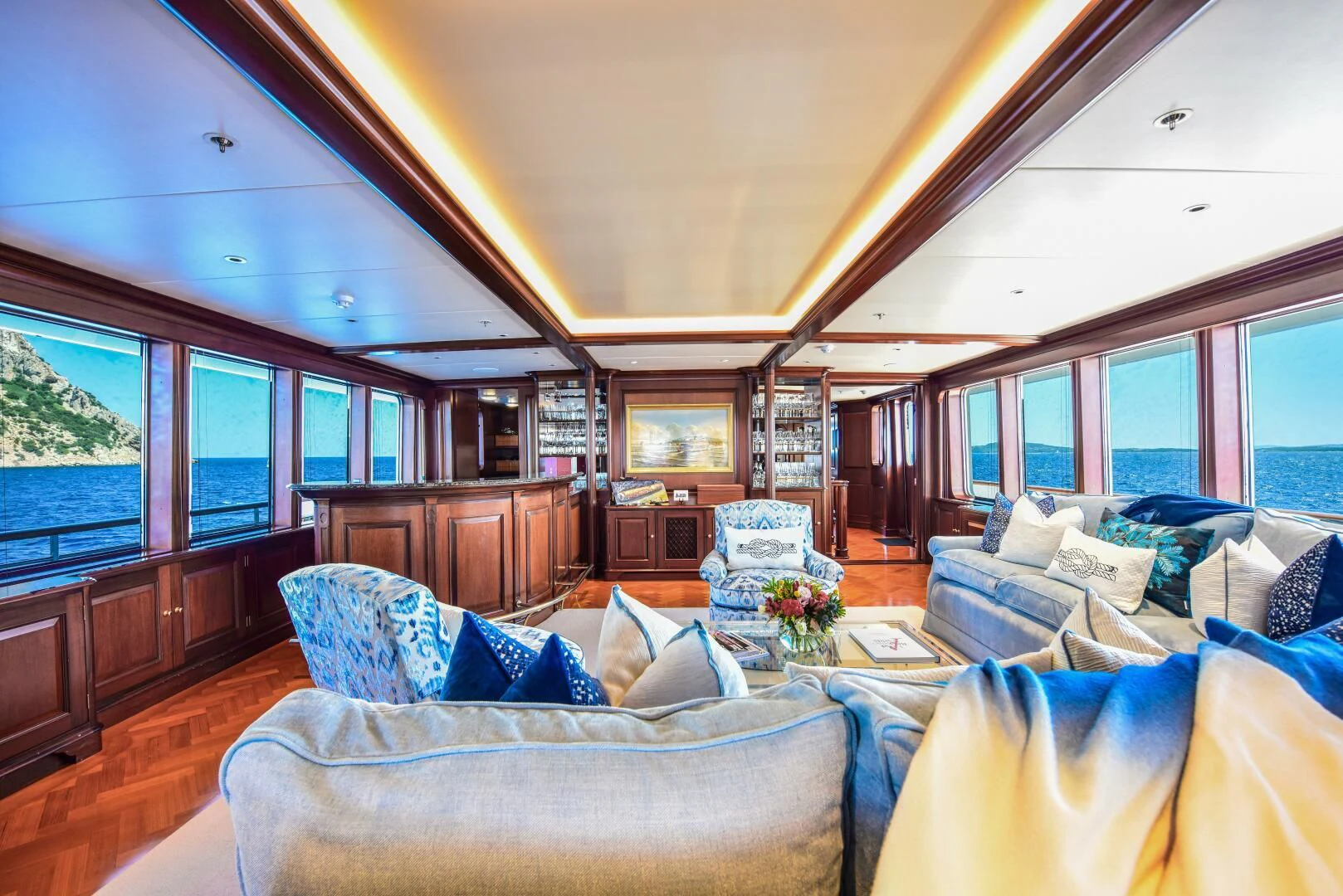 a living room with a large window aboard HALCYON Yacht for Sale