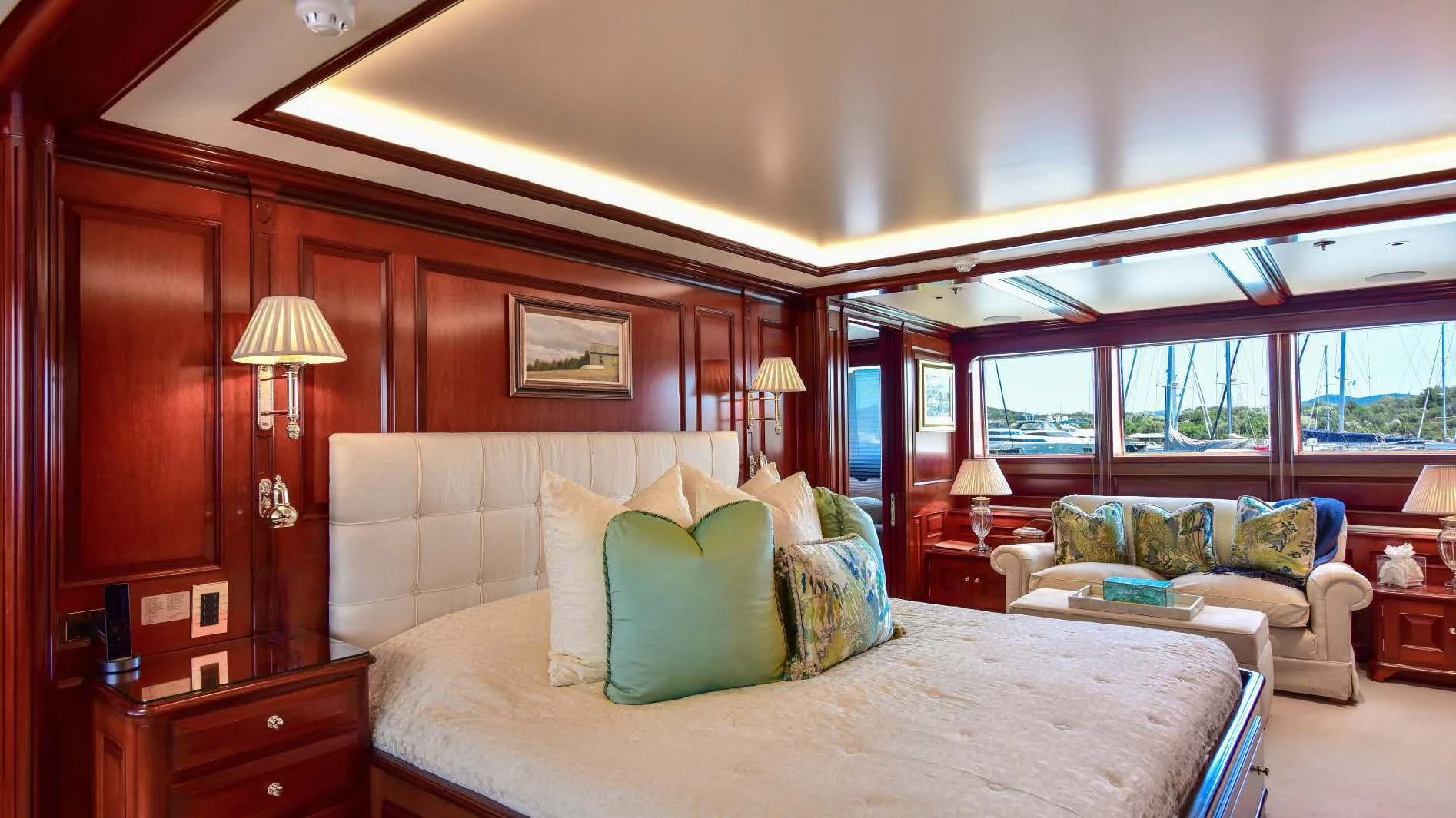 a bedroom with a bed and a couch aboard HALCYON Yacht for Sale