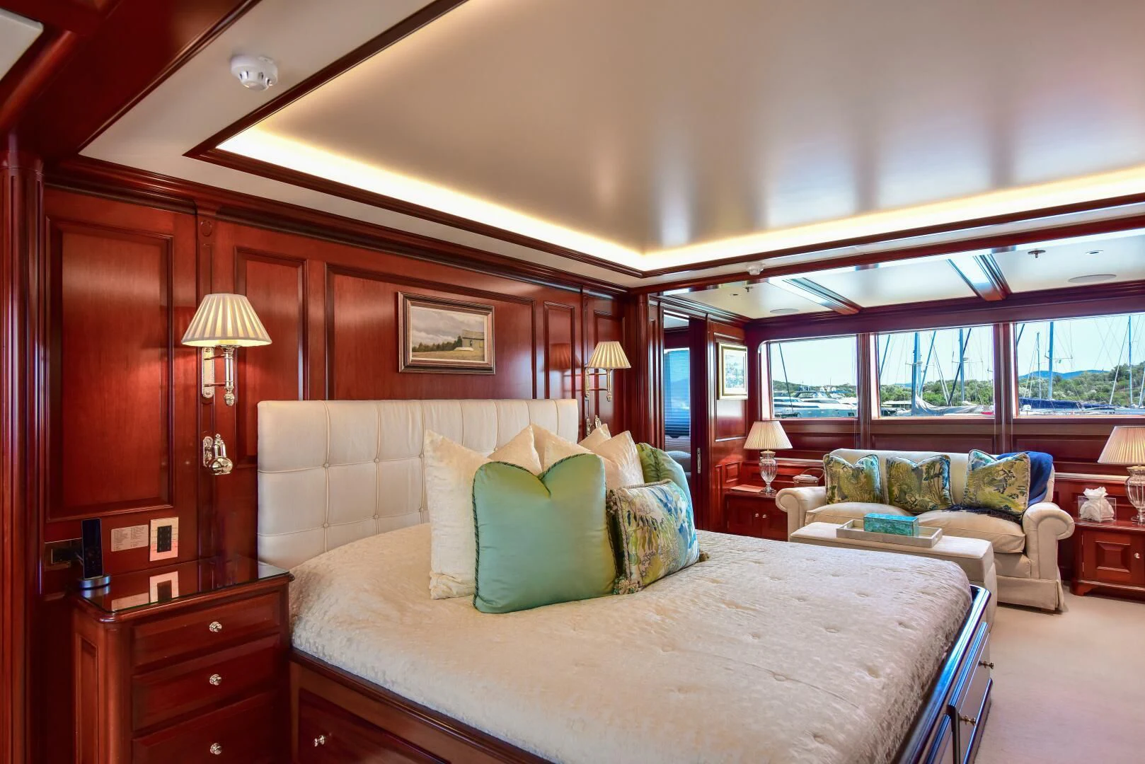 a bedroom with a bed and a couch aboard HALCYON Yacht for Sale