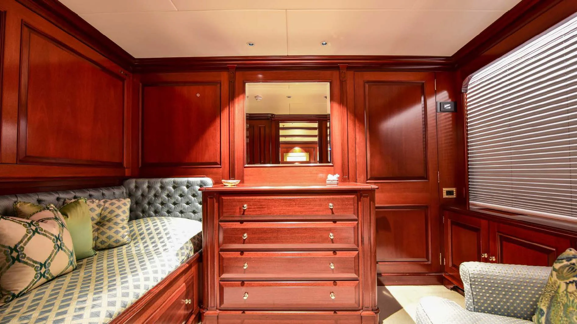a room with a bed and a couch aboard HALCYON Yacht for Sale