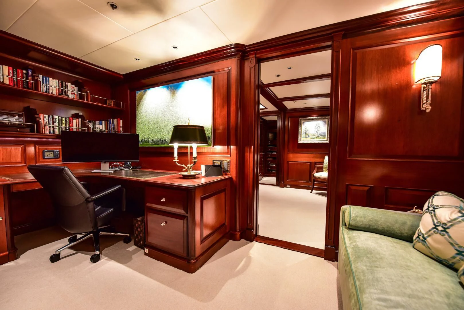 a room with a desk and a couch aboard HALCYON Yacht for Sale