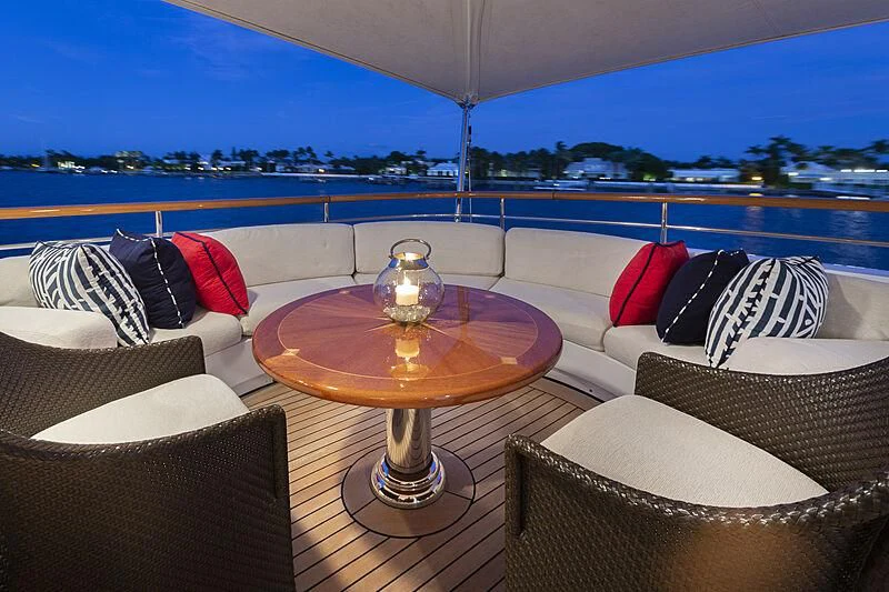 a living room with a table and chairs aboard HALCYON Yacht for Sale