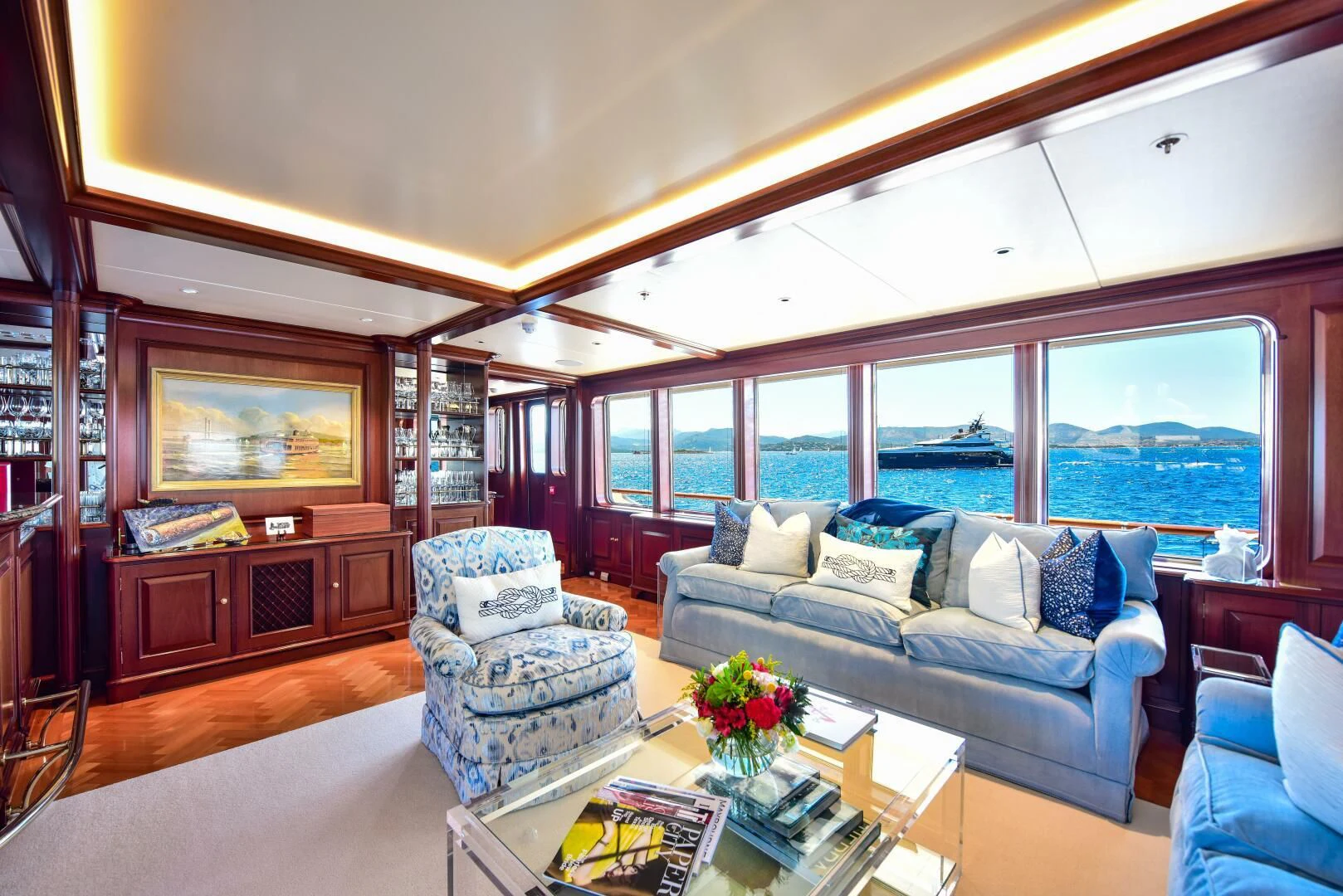 a living room with a large window aboard HALCYON Yacht for Sale