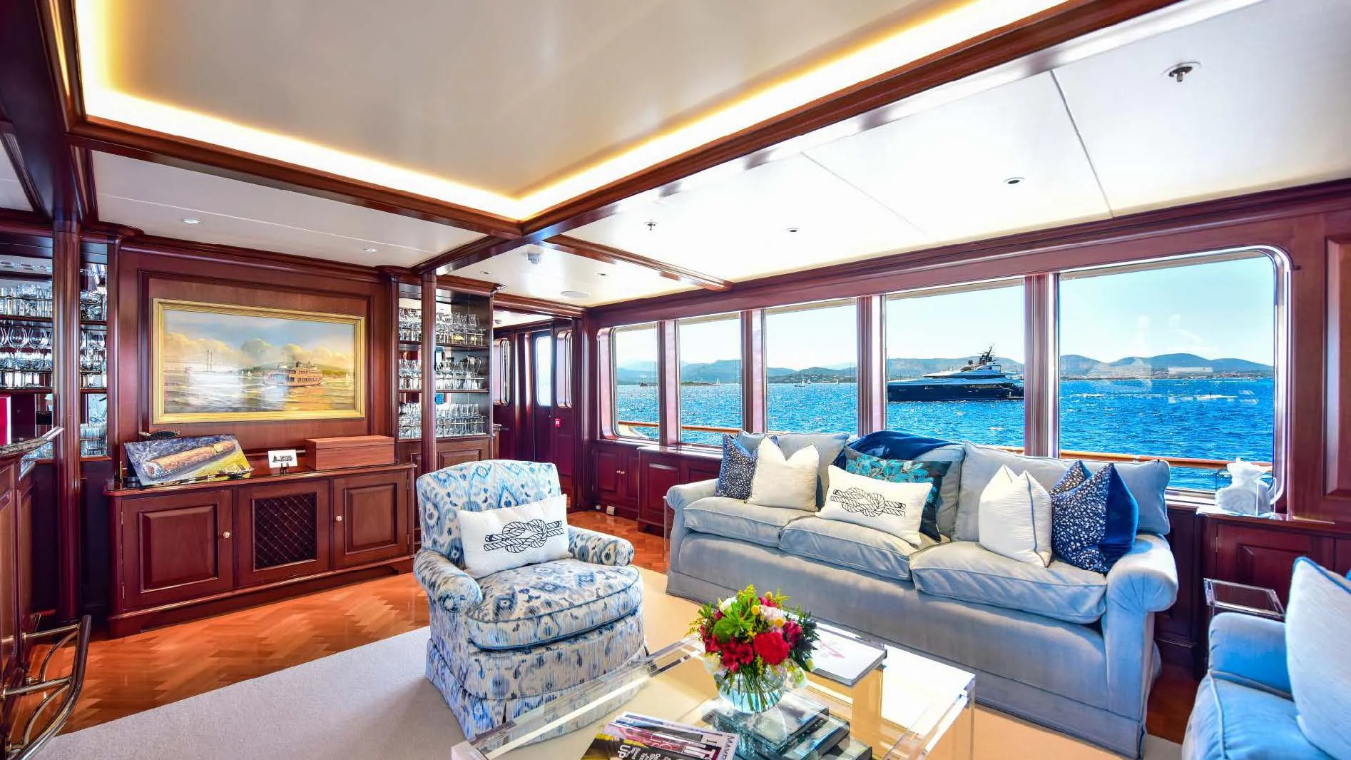 a living room with a large window aboard HALCYON Yacht for Sale