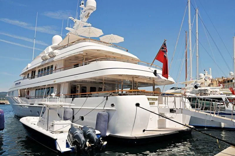 a boat with a flag on the front aboard HALCYON Yacht for Sale