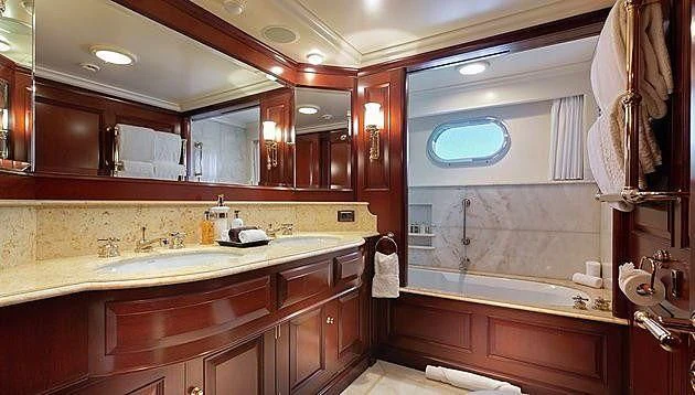a bathroom with a large mirror aboard HALCYON Yacht for Sale