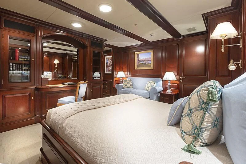 a bedroom with a large bed aboard HALCYON Yacht for Sale