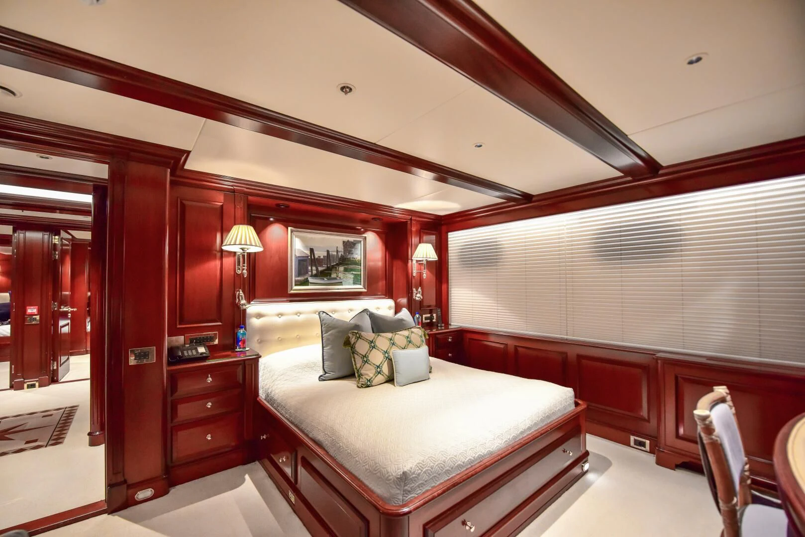 a bedroom with a bed and a desk aboard HALCYON Yacht for Sale