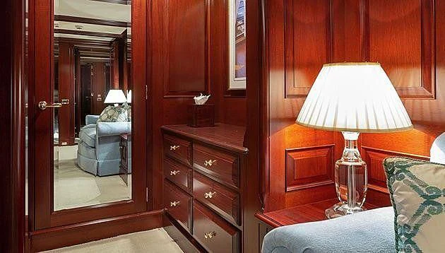 a room with a lamp and a mirror aboard HALCYON Yacht for Sale