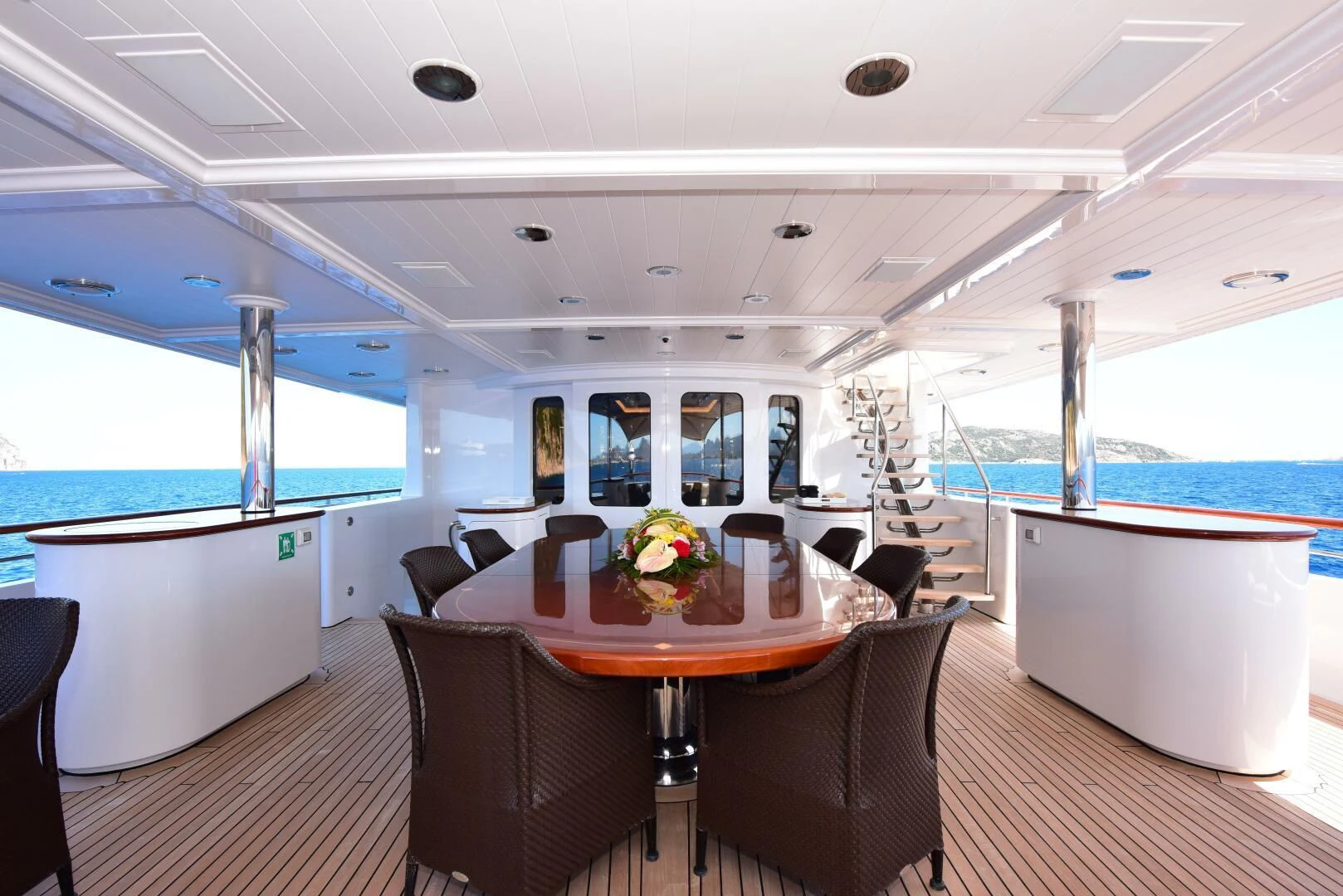 a room with a table and chairs aboard HALCYON Yacht for Sale