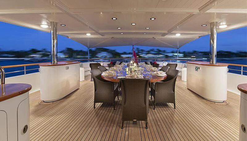 a room with a table and chairs aboard HALCYON Yacht for Sale