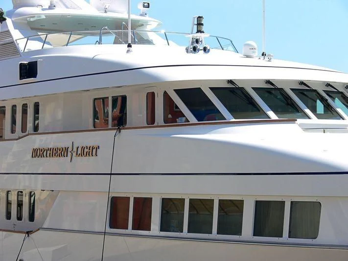 a white train with a bell on the front aboard HALCYON Yacht for Sale