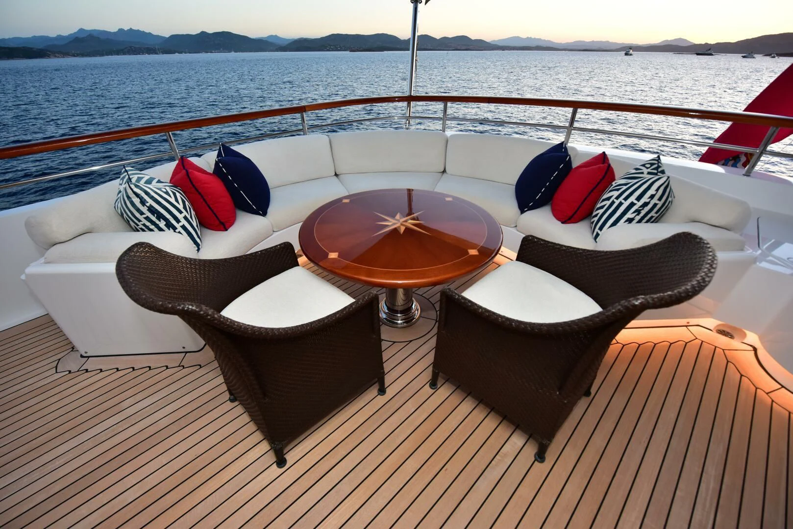 a group of chairs on a deck overlooking a body of water aboard HALCYON Yacht for Sale