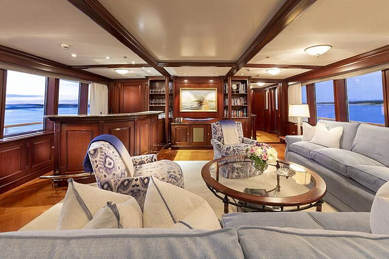 a living room with a couch and a coffee table aboard HALCYON Yacht for Sale