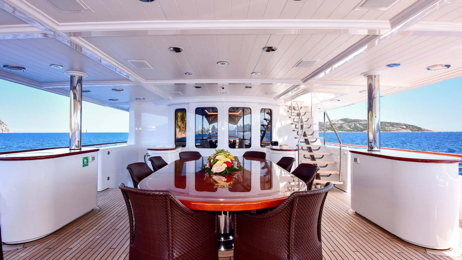 a room with a table chairs and a large window aboard HALCYON Yacht for Sale