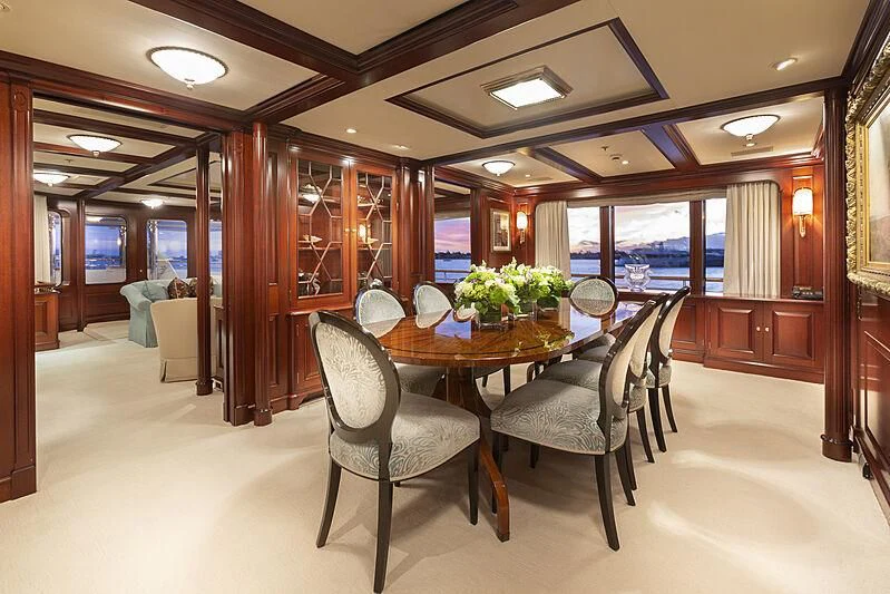 a dining room with a table and chairs aboard HALCYON Yacht for Sale