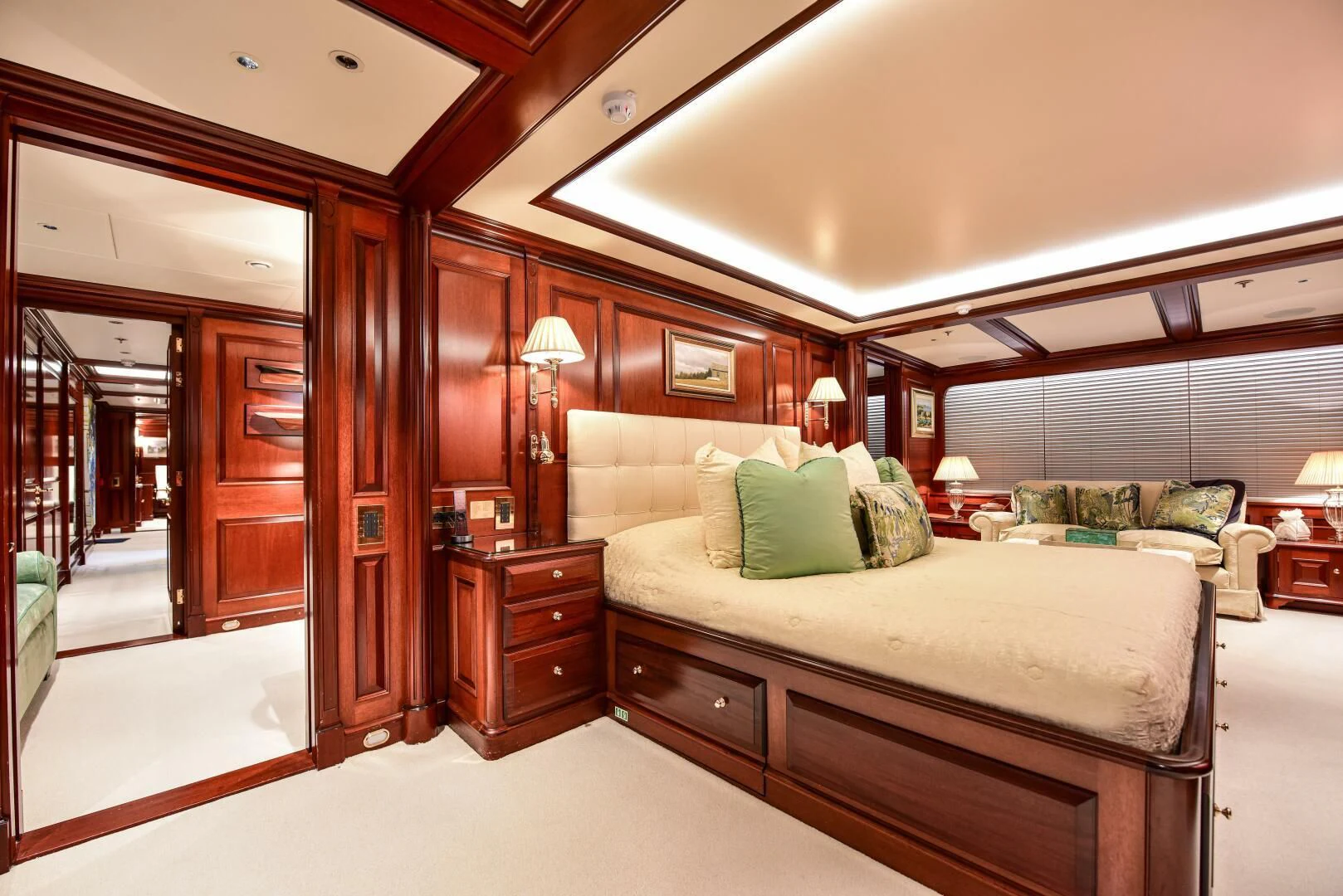 a bedroom with a bed and a couch aboard HALCYON Yacht for Sale