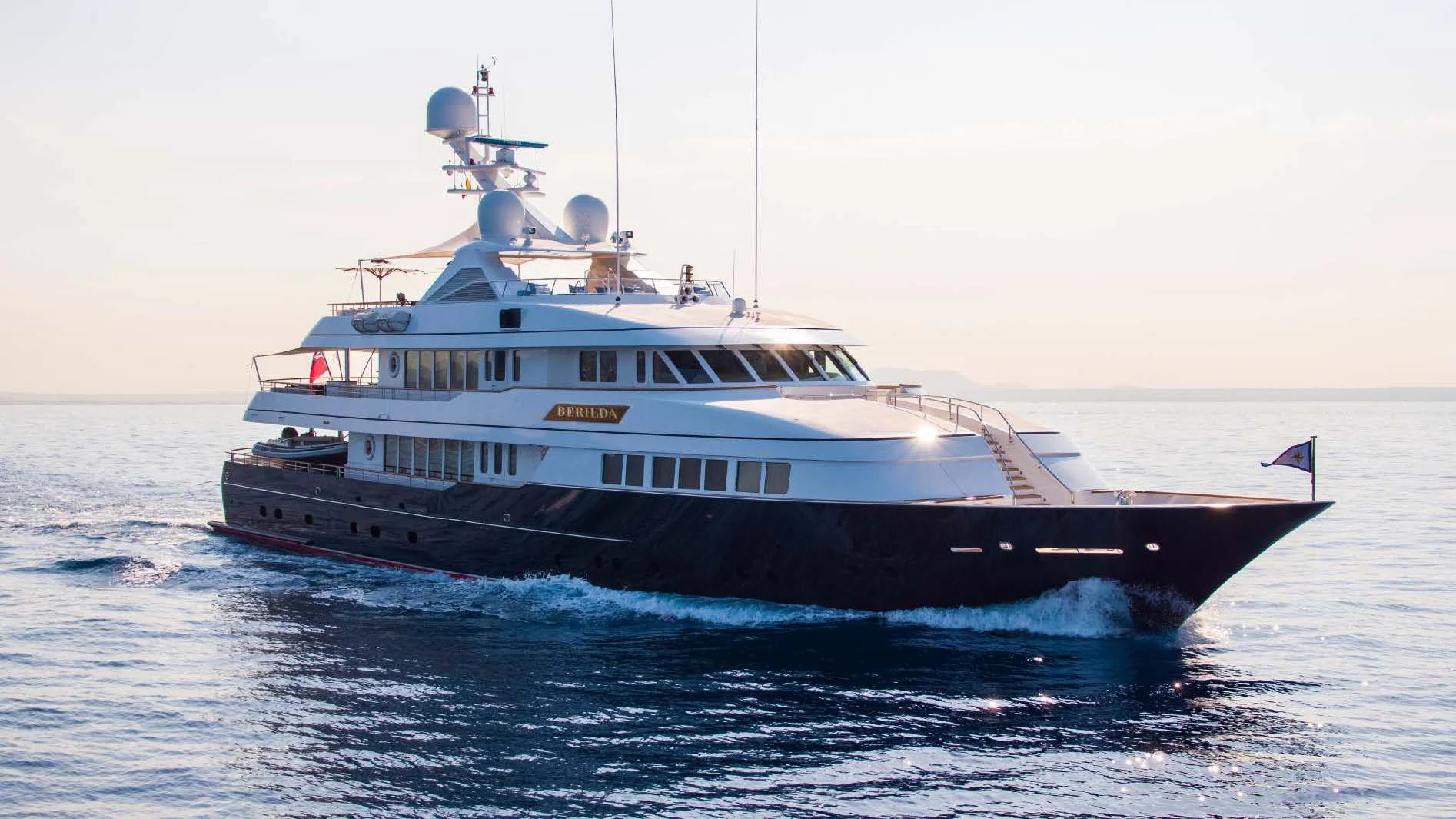 a large boat in the water aboard HALCYON Yacht for Sale