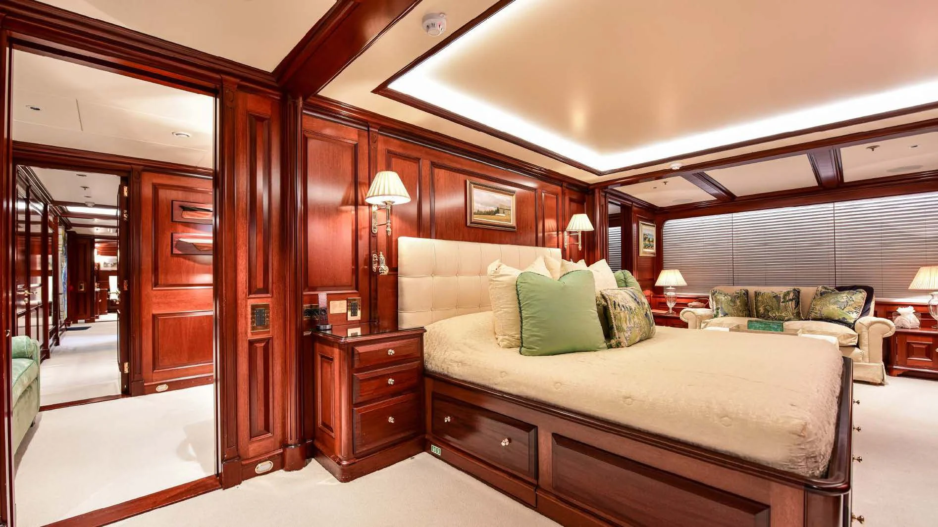 a bedroom with a bed and a couch aboard HALCYON Yacht for Sale