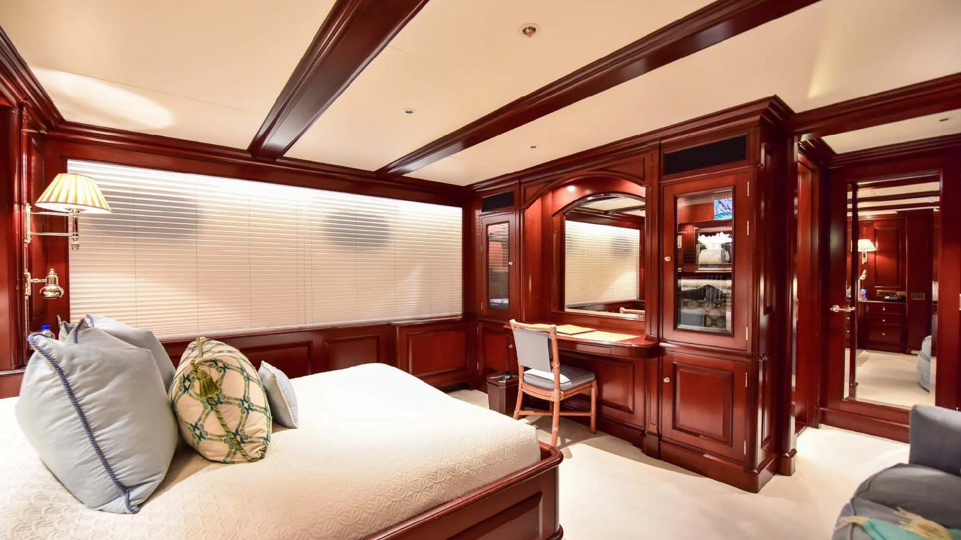 a hotel room with a bed and a desk aboard HALCYON Yacht for Sale
