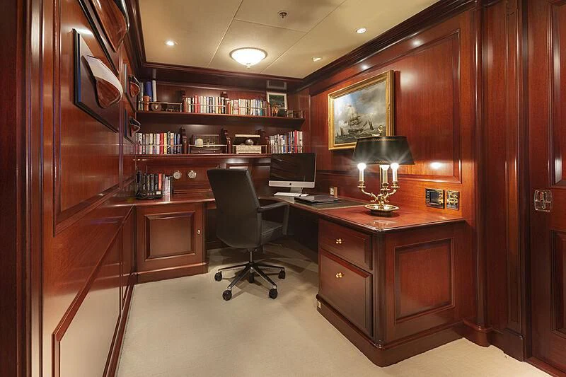 a room with a desk and a chair aboard HALCYON Yacht for Sale