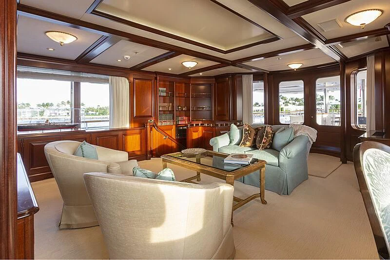 a living room with a couch and a table aboard HALCYON Yacht for Sale