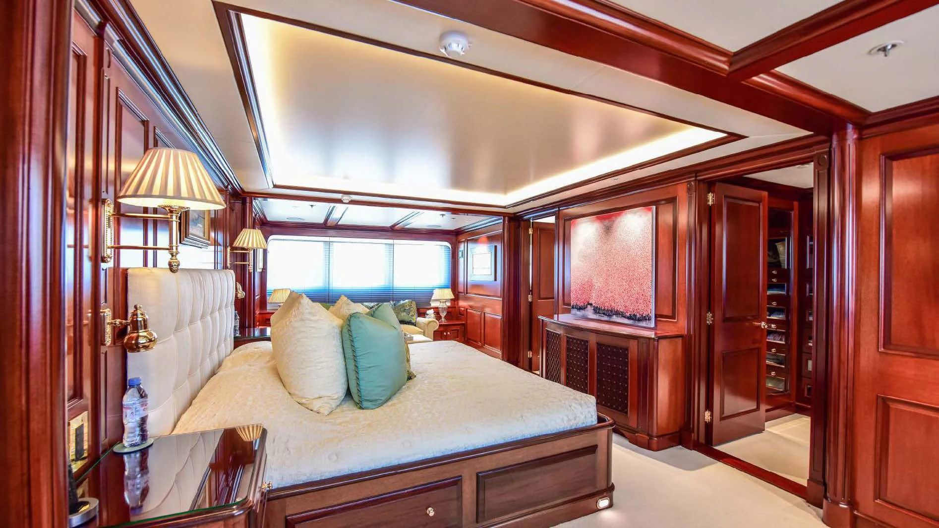 a bedroom with a large bed aboard HALCYON Yacht for Sale