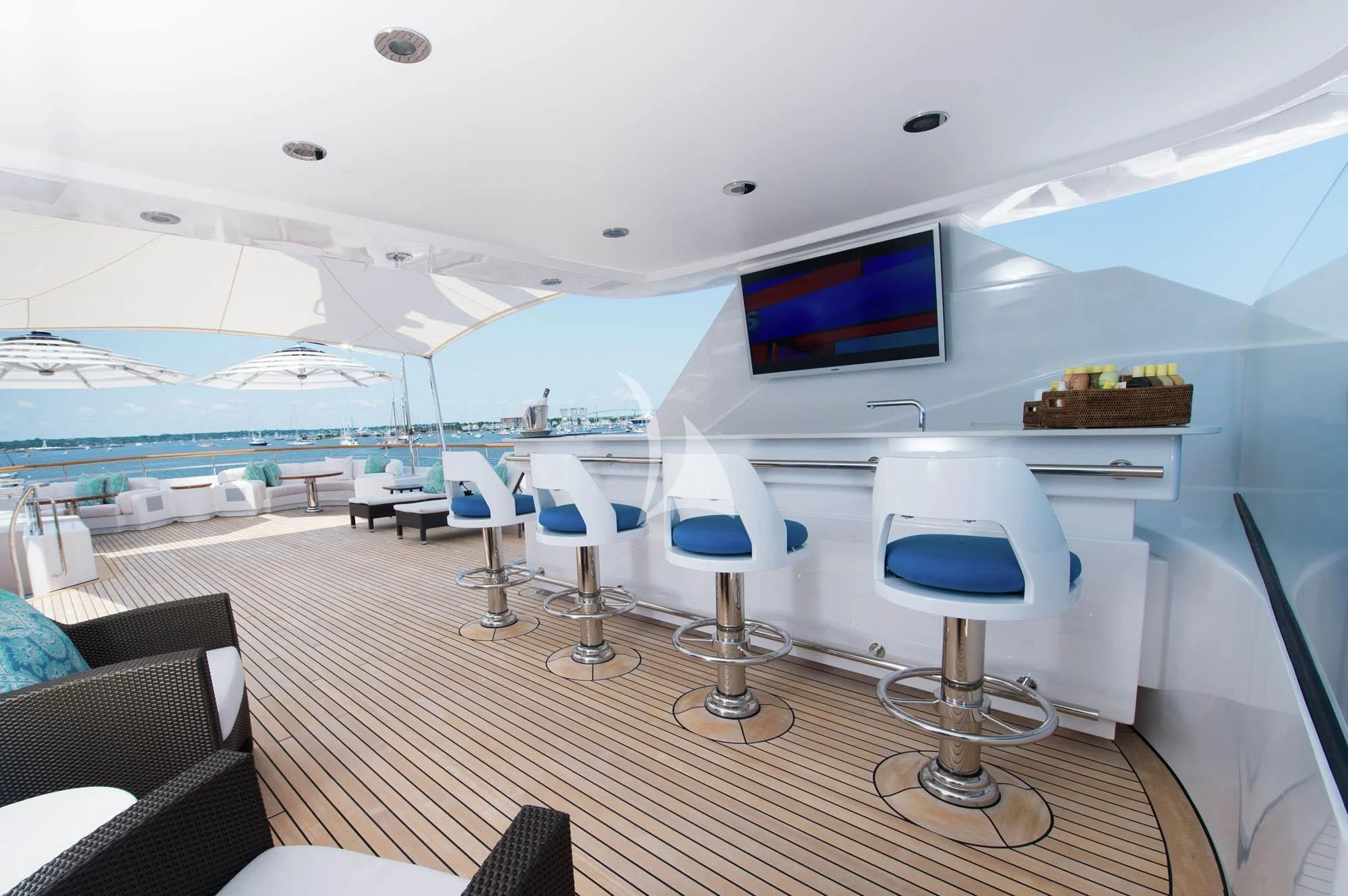 a room with a table chairs and a tv on the wall aboard HALCYON Yacht for Sale