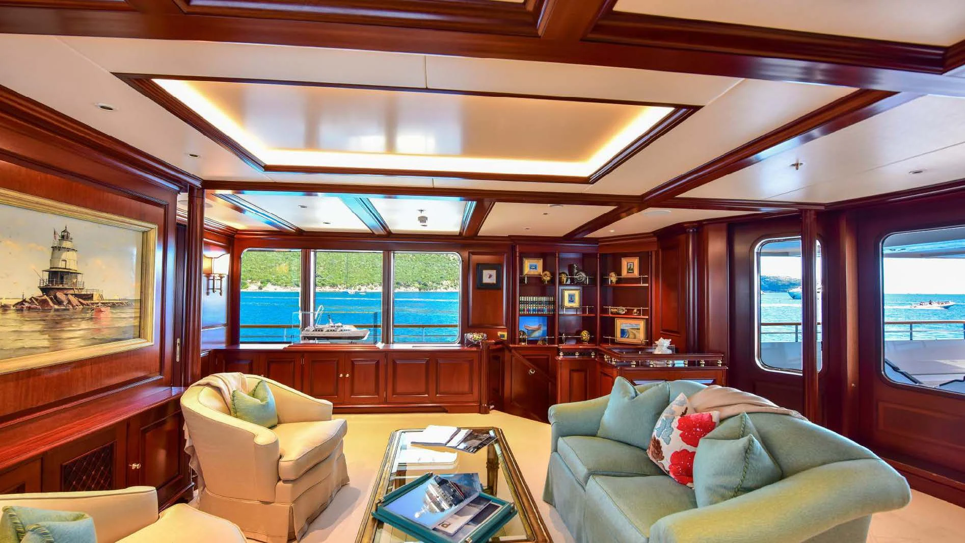 a living room with a large window aboard HALCYON Yacht for Sale