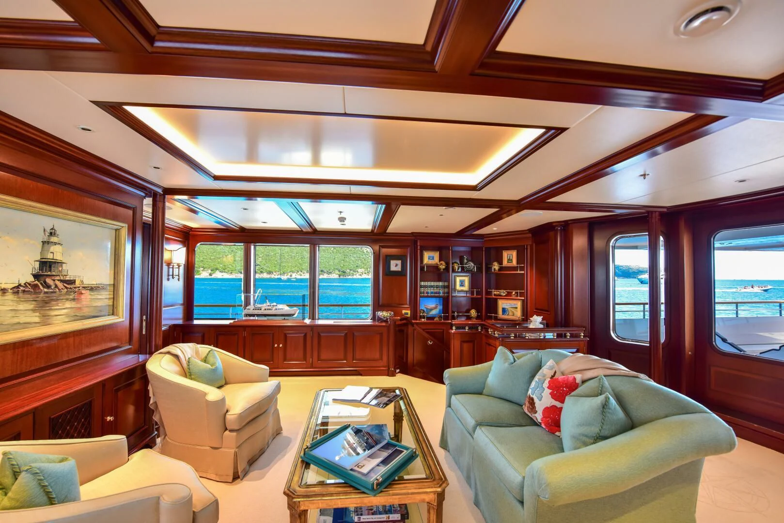 a living room with a large screen aboard HALCYON Yacht for Sale