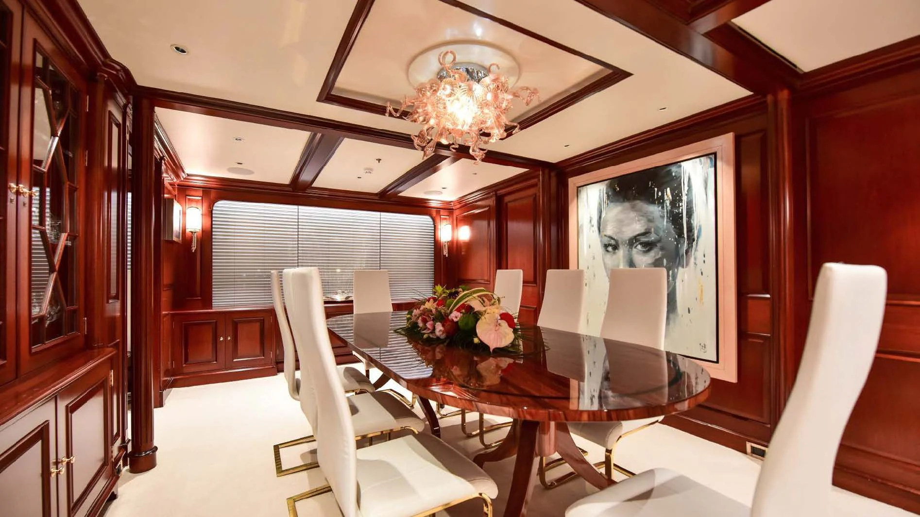 a dining room with a table and chairs aboard HALCYON Yacht for Sale
