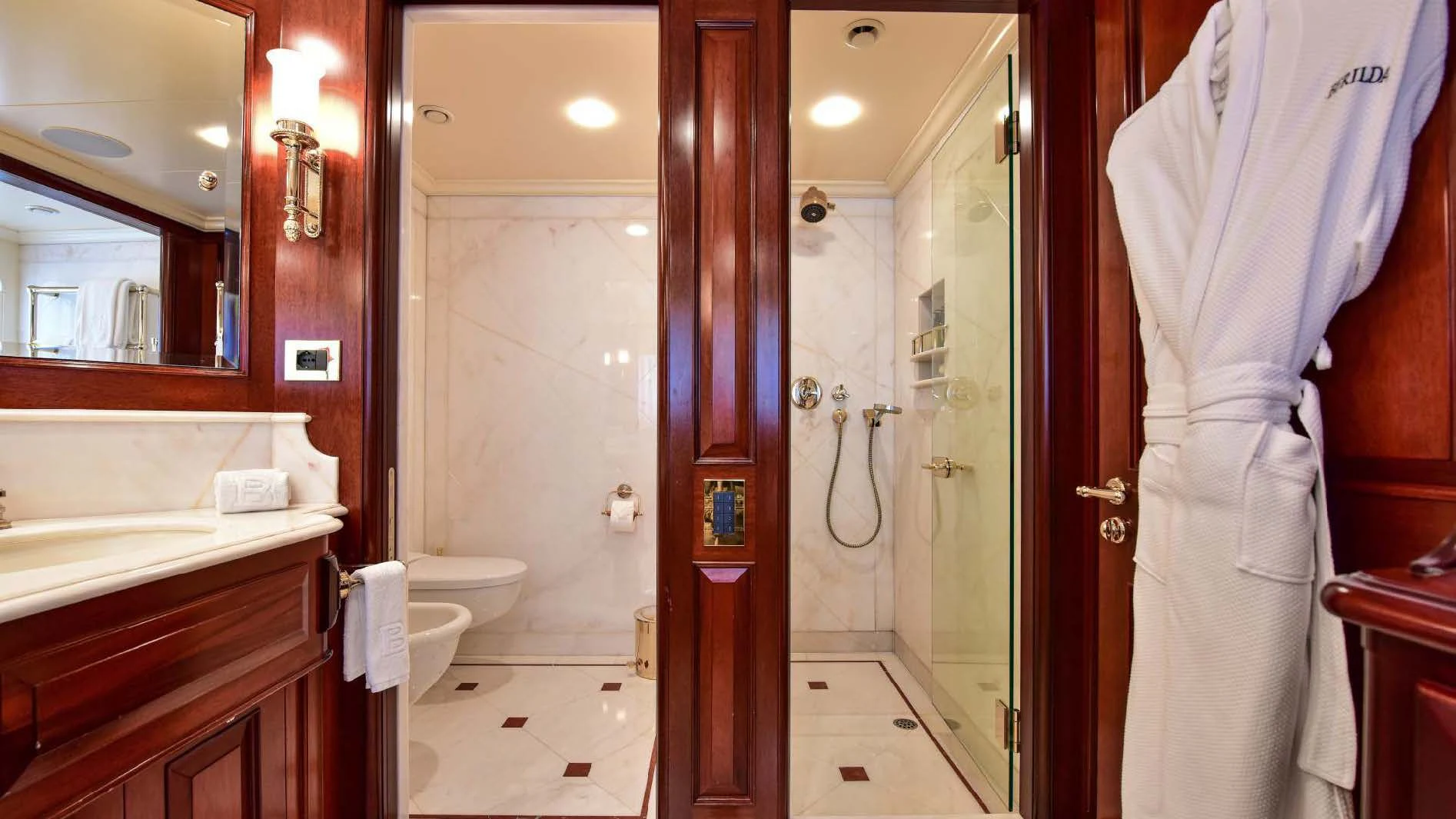 a bathroom with a glass shower aboard HALCYON Yacht for Sale