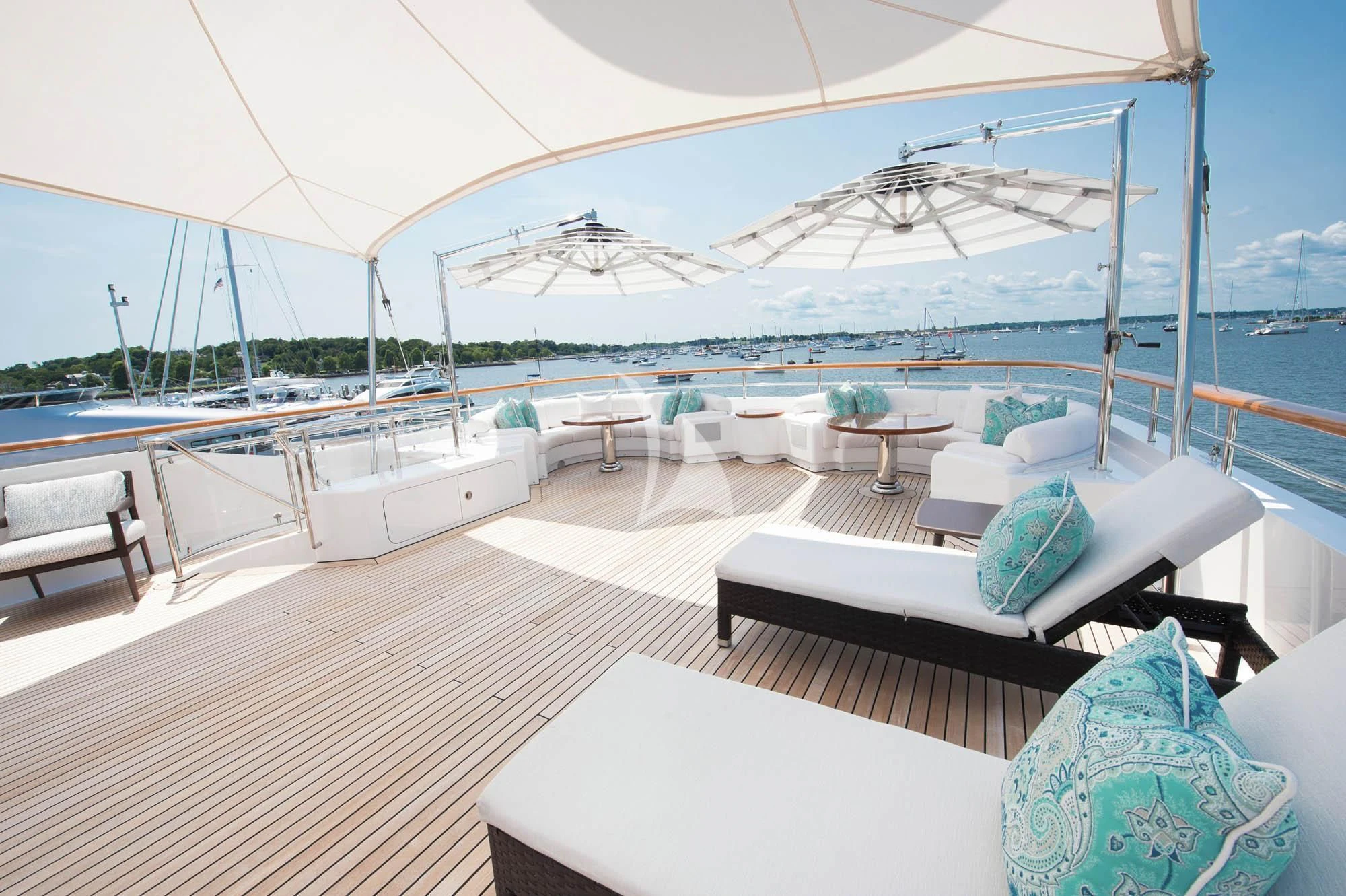 a large white lounge area with a large white umbrella over it aboard HALCYON Yacht for Sale