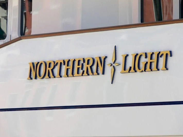 a white sign with yellow text aboard HALCYON Yacht for Sale