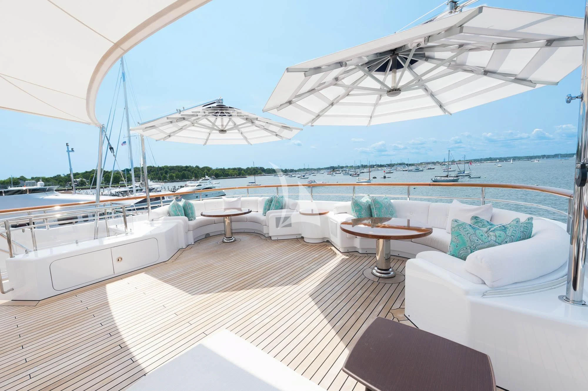 a large white lounge area with a large white umbrella over it aboard HALCYON Yacht for Sale