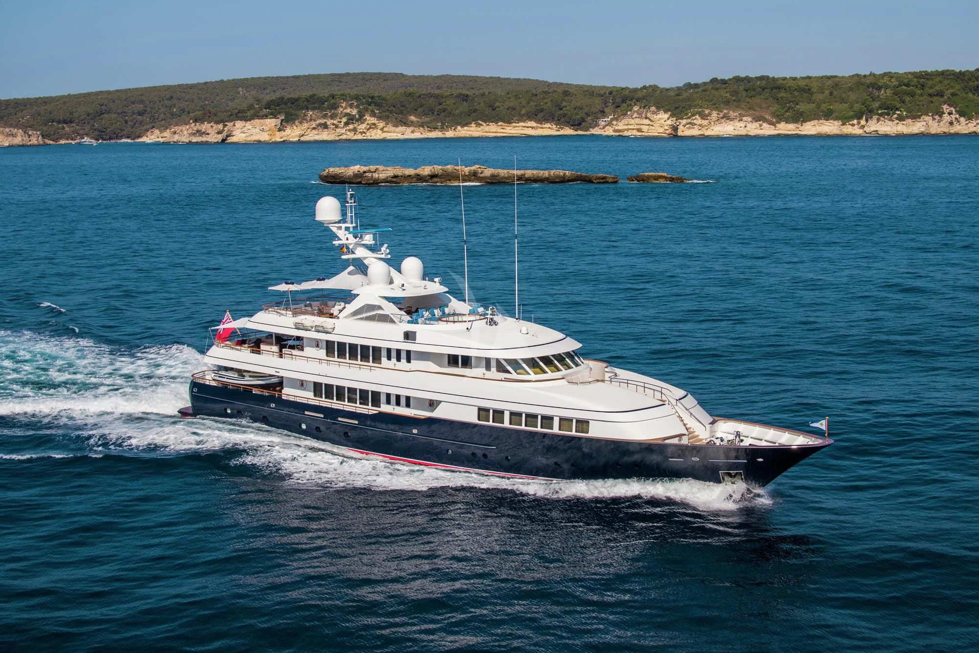 a large white boat on the water aboard HALCYON Yacht for Sale