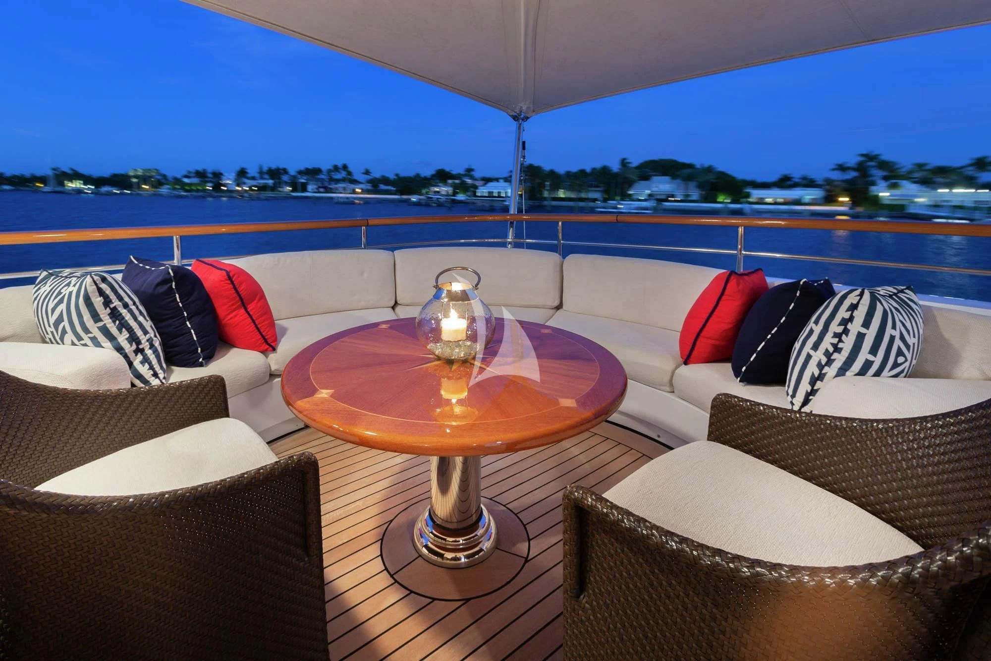 a couch and a table in a room with a view of a city aboard HALCYON Yacht for Sale