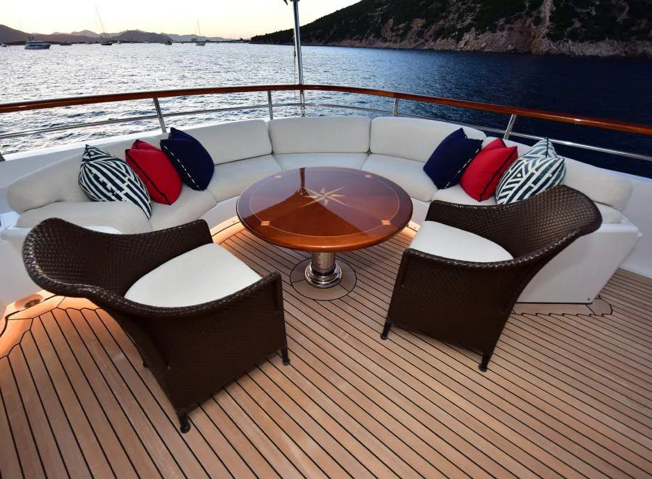 a couple of chairs on a deck overlooking a body of water aboard HALCYON Yacht for Sale