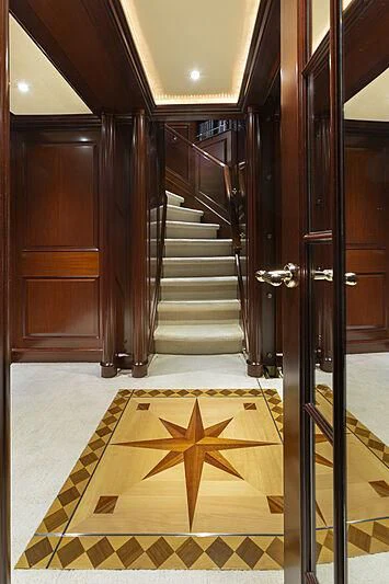 a large wooden door with a tile floor aboard HALCYON Yacht for Sale