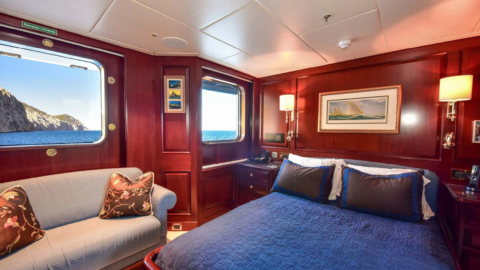 a room with a bed and a window aboard HALCYON Yacht for Sale