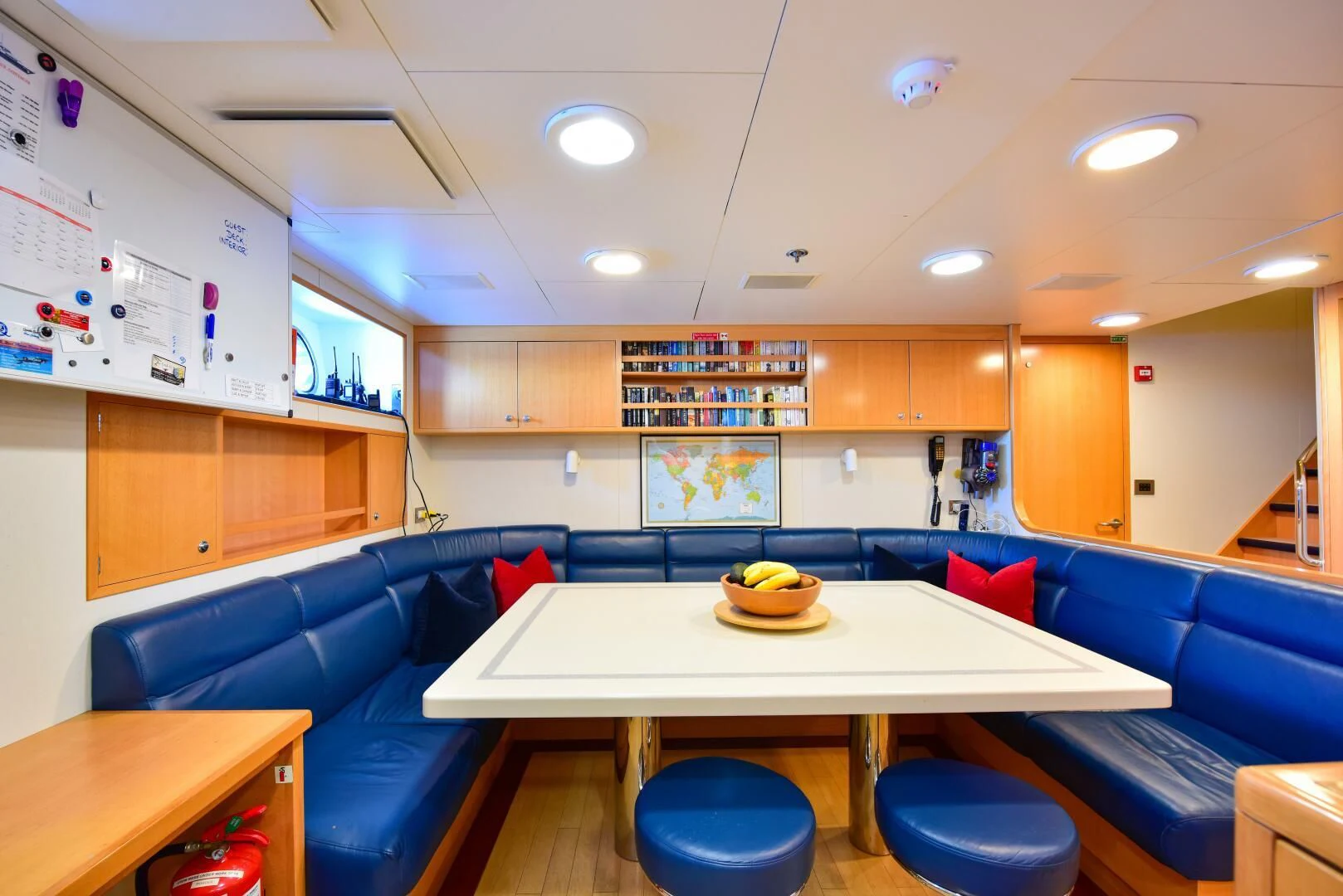 a room with a table and chairs aboard HALCYON Yacht for Sale
